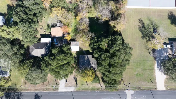 an aerial view of house with yard