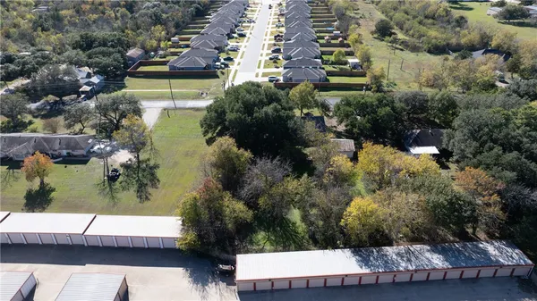 an aerial view of house with yard