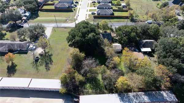 a aerial view of a house with a yard
