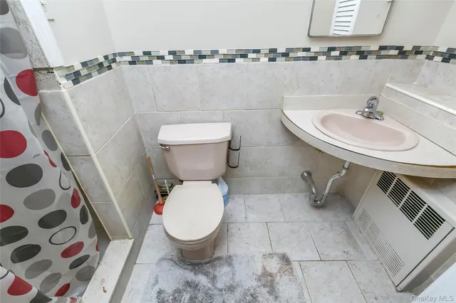 a bathroom with a toilet and a sink