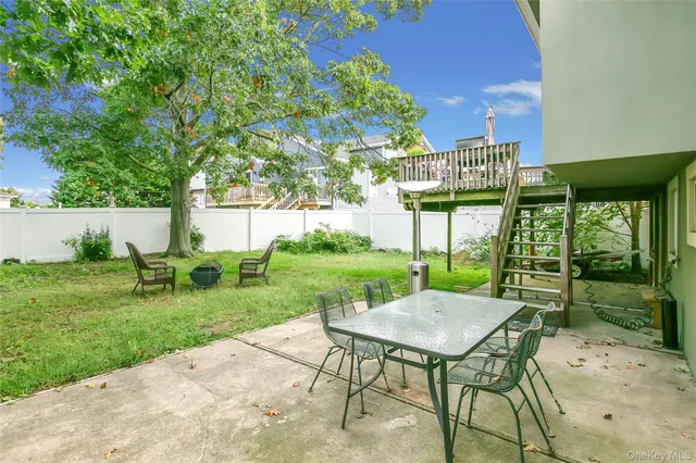 a view of a table and chairs in the garden