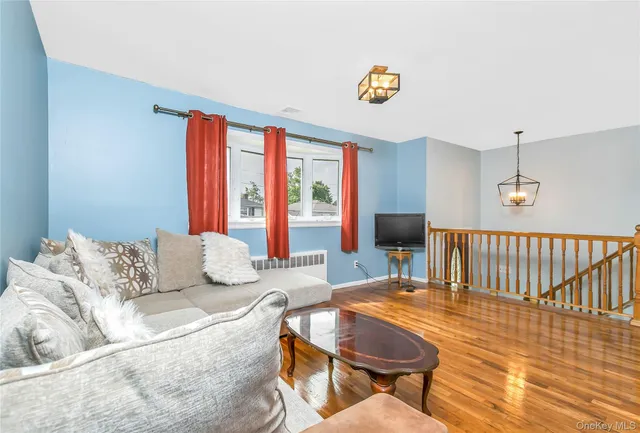 a living room with furniture and a table