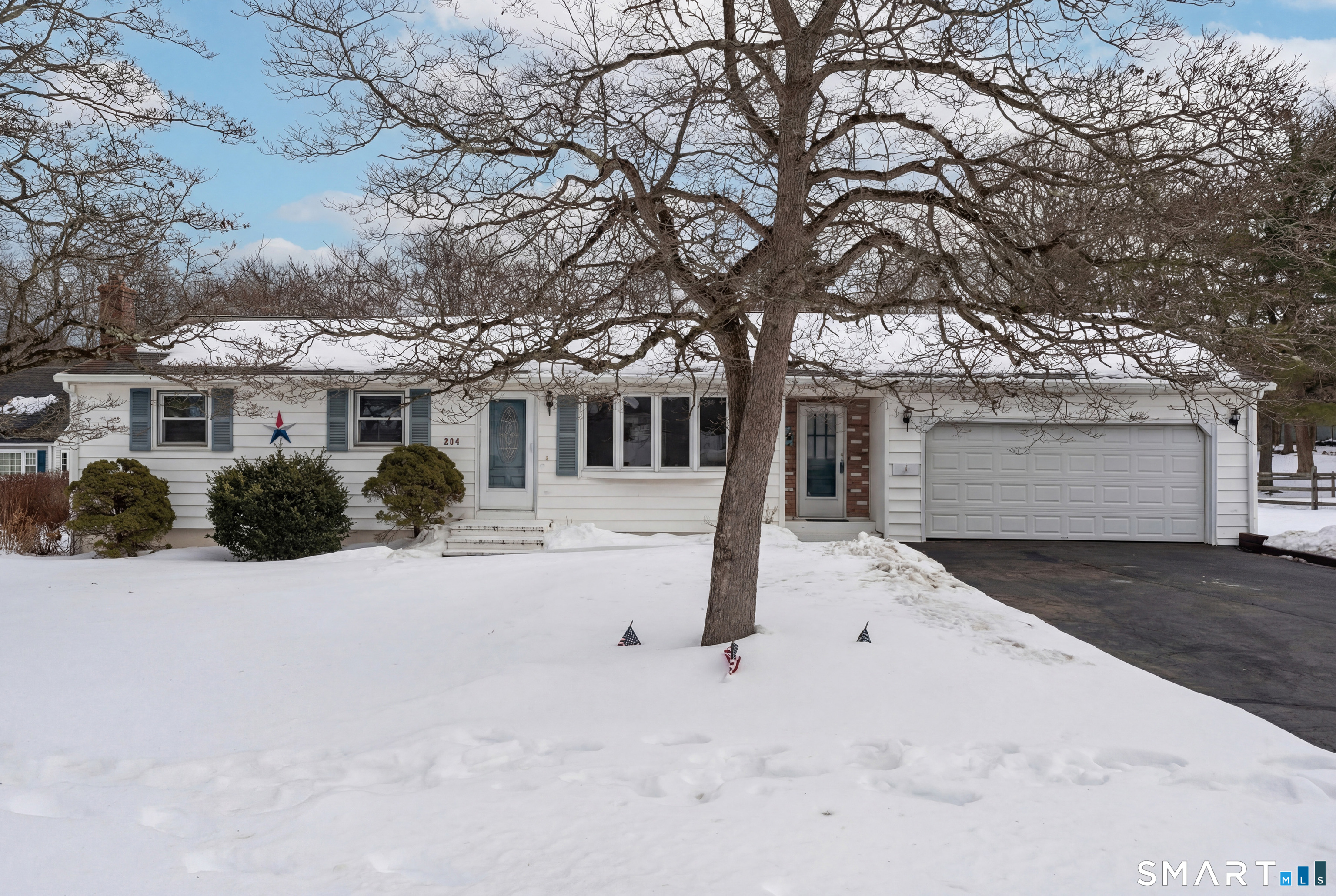 204 Parker Farms Road Wallingford, CT 06492 - Photo 1 of 39 a front view of a house with a yard and garage