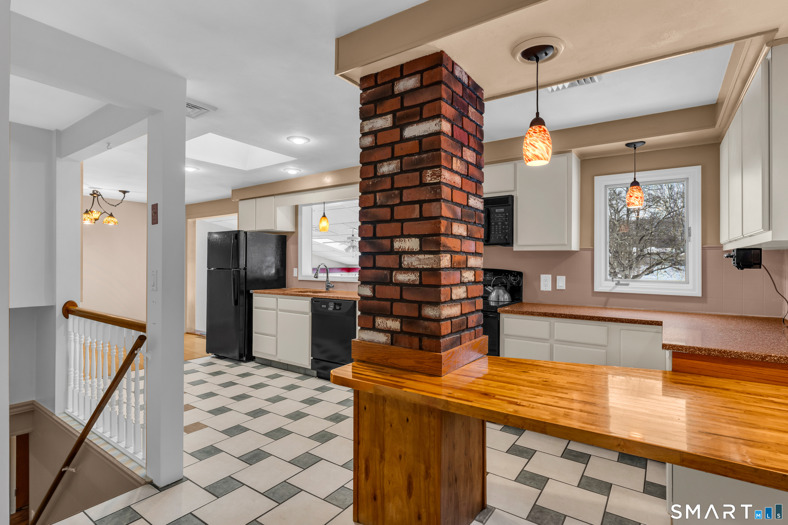 204 Parker Farms Road Wallingford, CT 06492 - Photo 12 of 39 a kitchen with a sink and a refrigerator