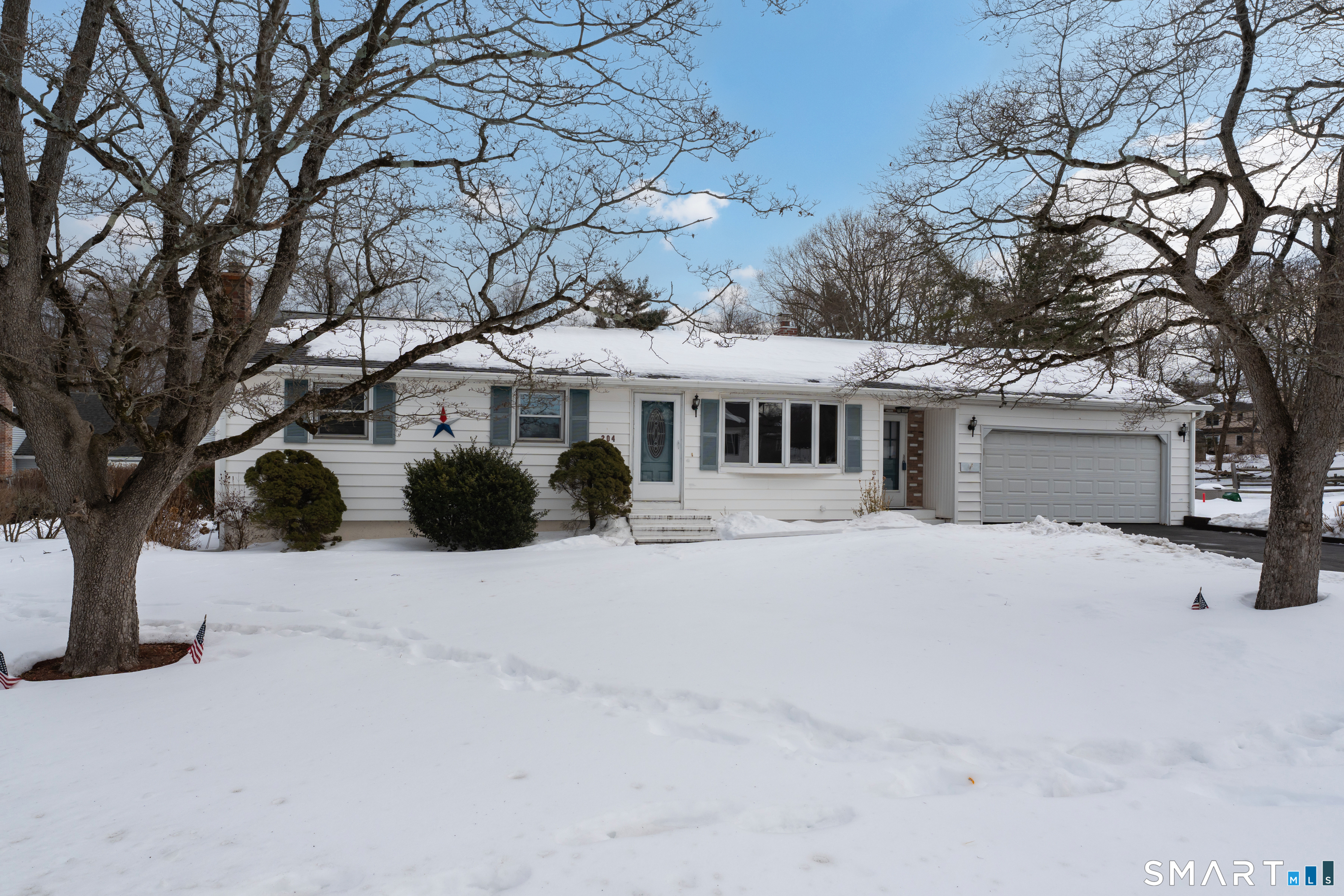 204 Parker Farms Road Wallingford, CT 06492 - Photo 2 of 39 a front view of a house with a yard covered with snow in front of house