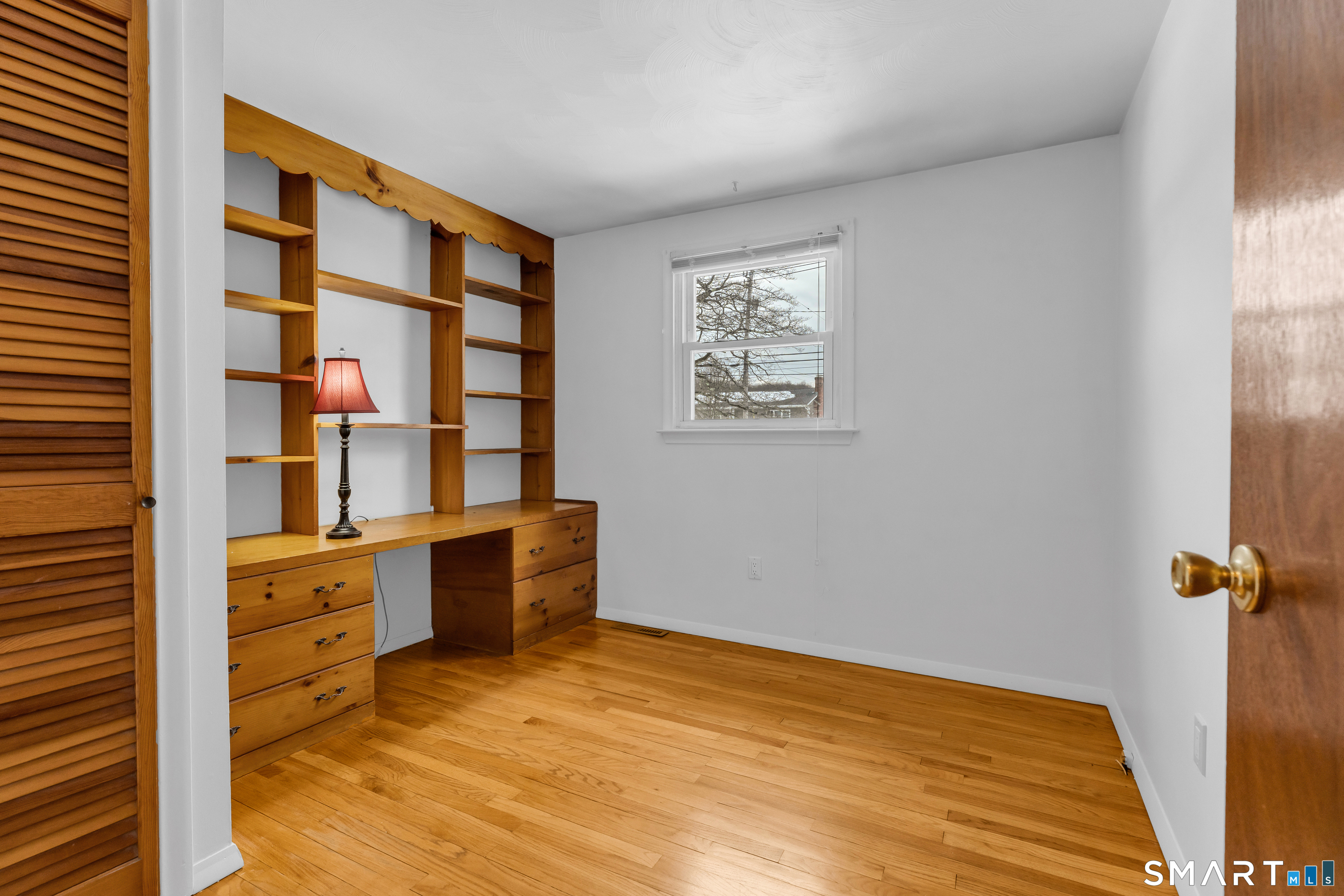 204 Parker Farms Road Wallingford, CT 06492 - Photo 24 of 39 a view of an empty room with wooden floor and a window