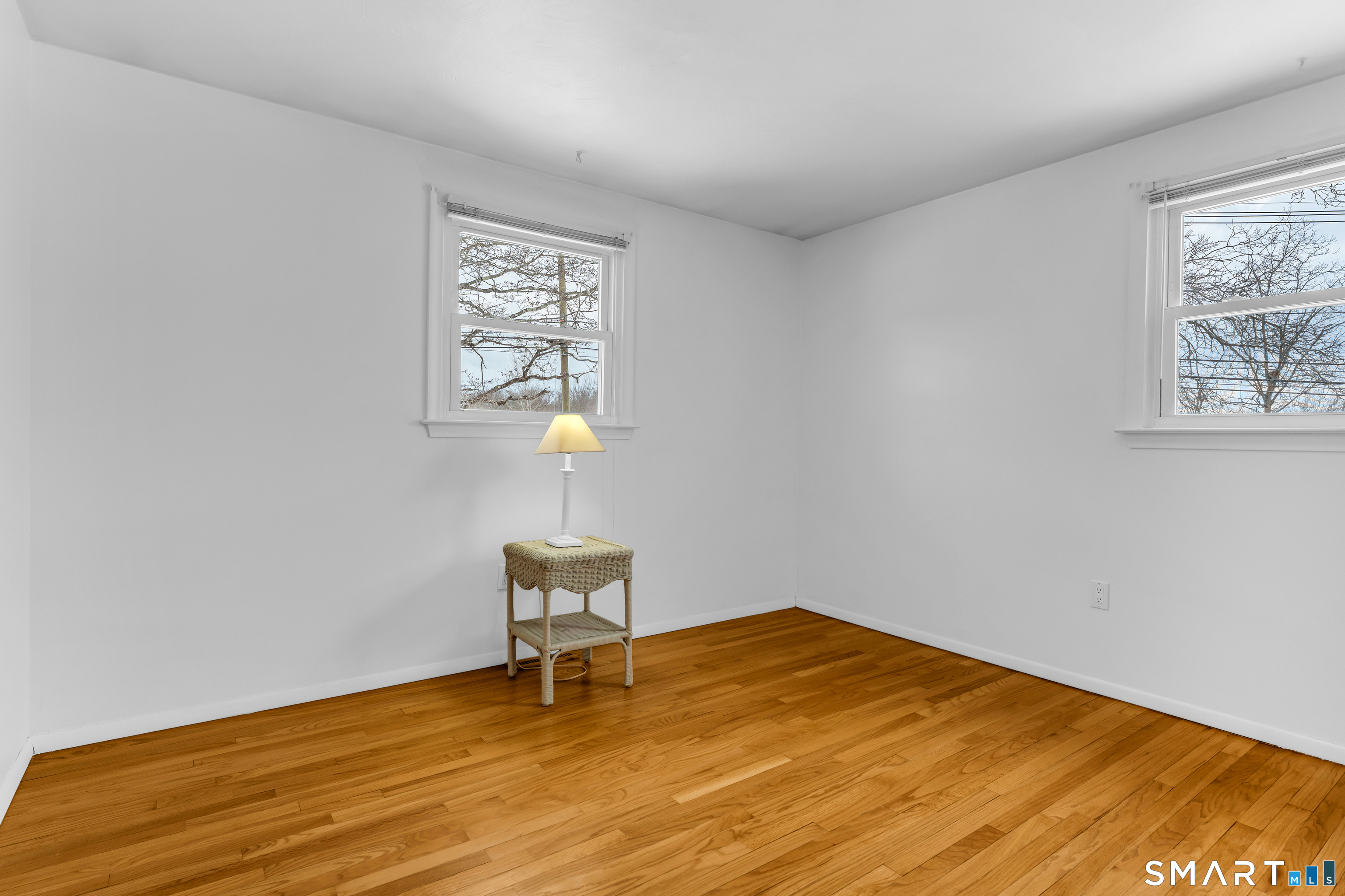 204 Parker Farms Road Wallingford, CT 06492 - Photo 26 of 39 a view of a room with wooden floor and a window