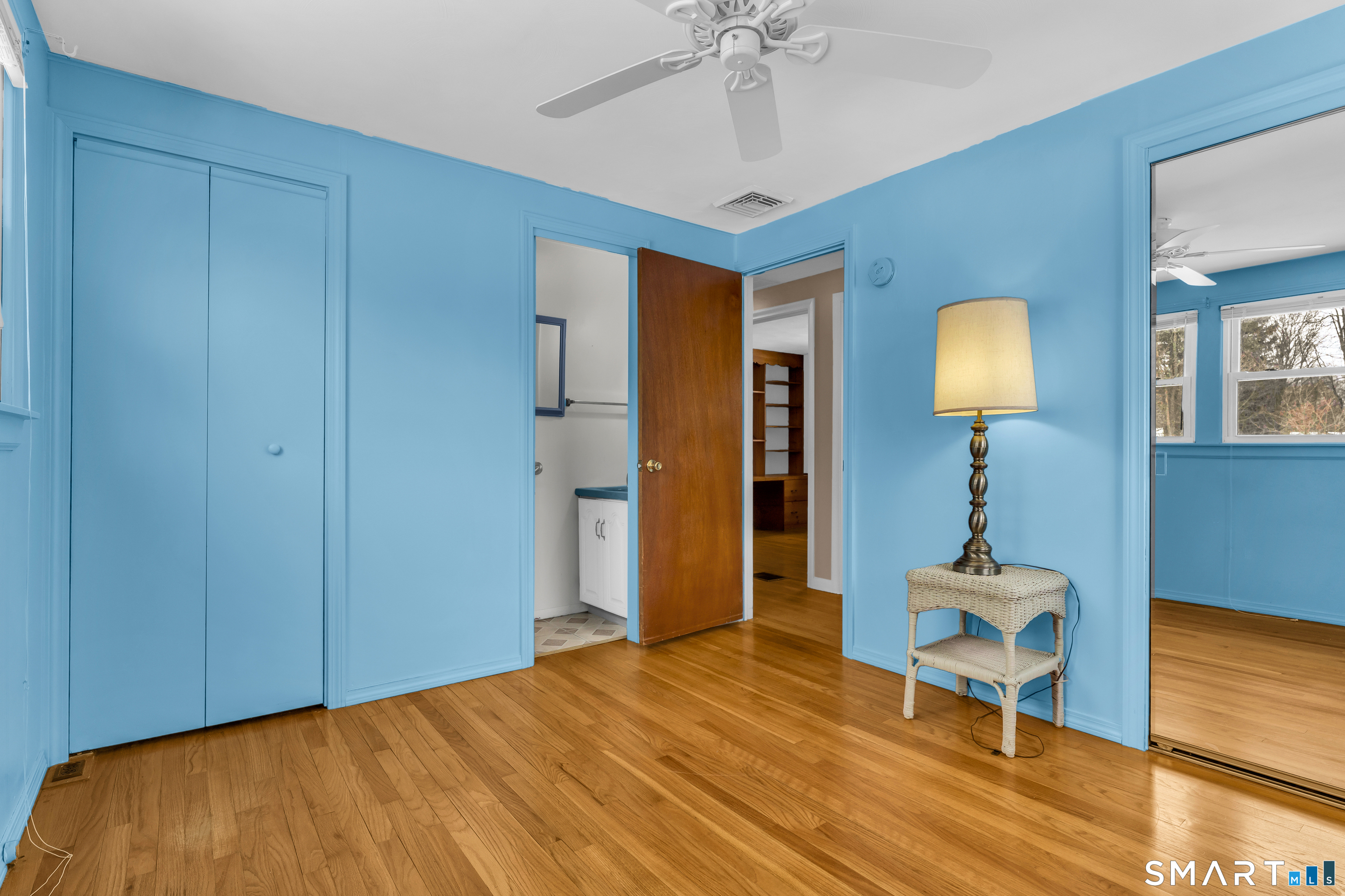 204 Parker Farms Road Wallingford, CT 06492 - Photo 30 of 39 a bedroom with a bed and a lamp on table