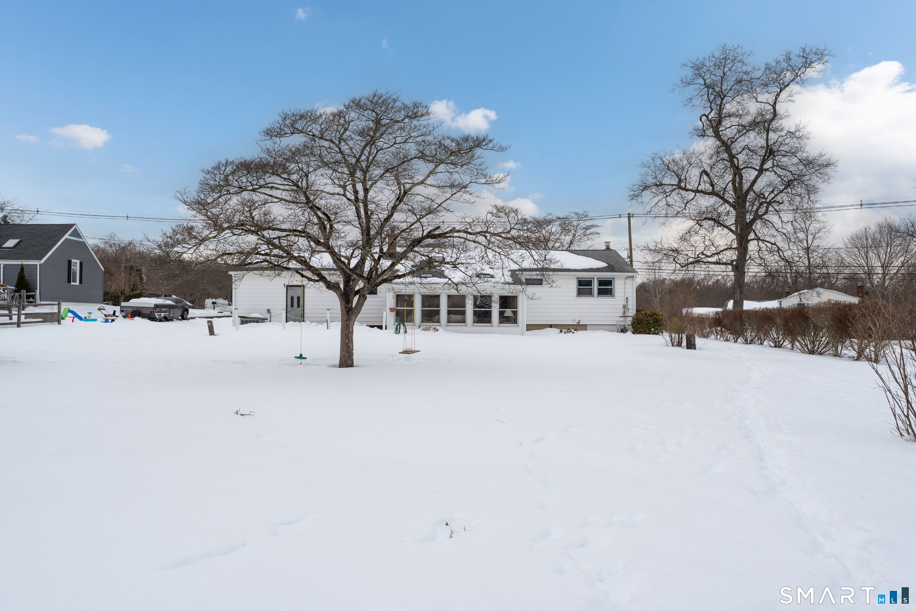 204 Parker Farms Road Wallingford, CT 06492 - Photo 3 of 39 a view of residential house with snow on the road