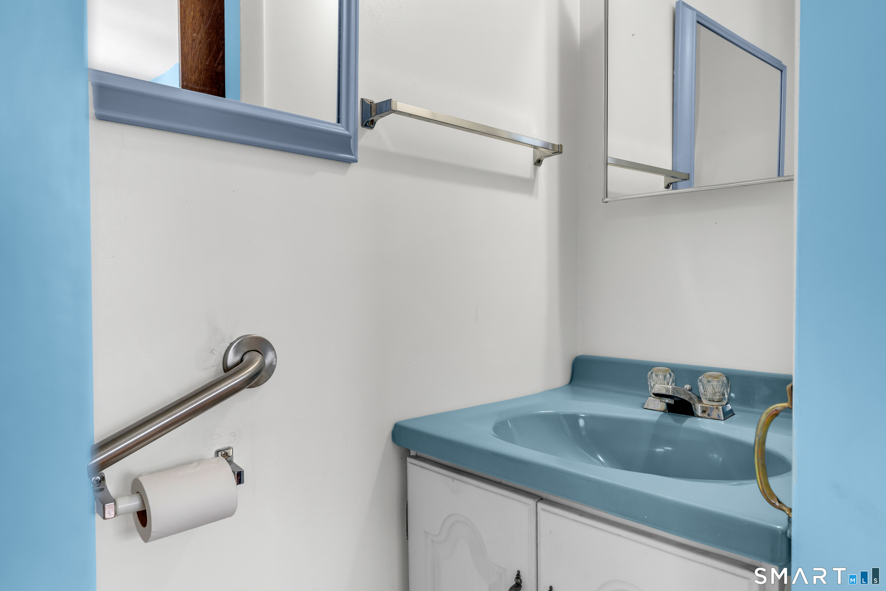 204 Parker Farms Road Wallingford, CT 06492 - Photo 31 of 39 a bathroom with a sink and mirror