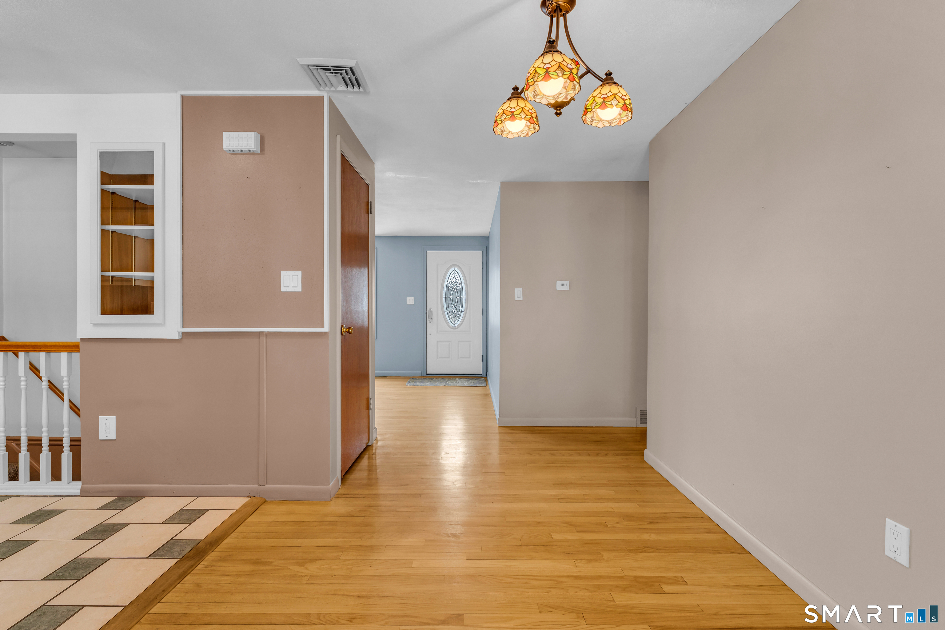 204 Parker Farms Road Wallingford, CT 06492 - Photo 6 of 39 a view of empty room with wooden floor and windows