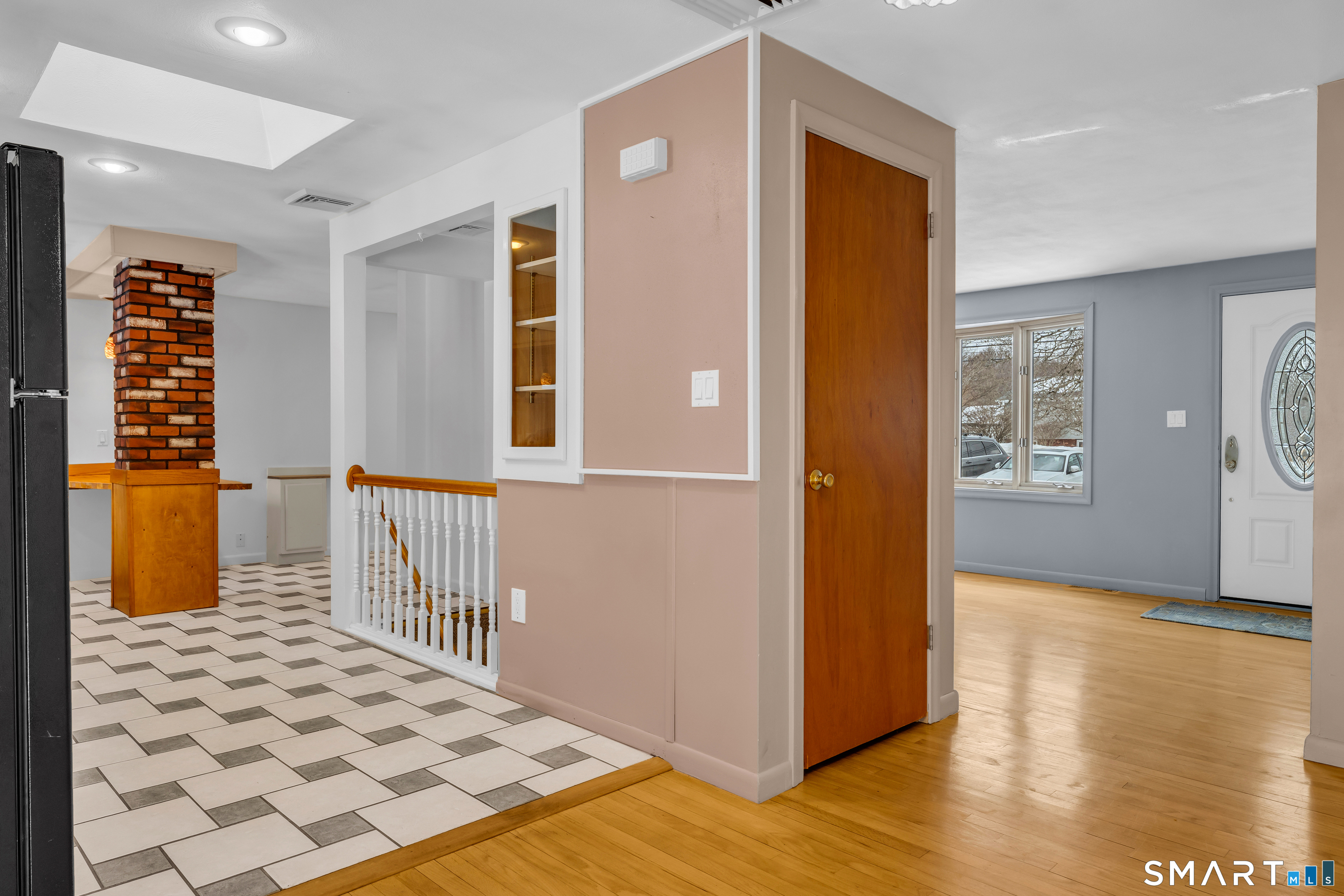 204 Parker Farms Road Wallingford, CT 06492 - Photo 9 of 39 a view of a hallway with wooden floor and a living room
