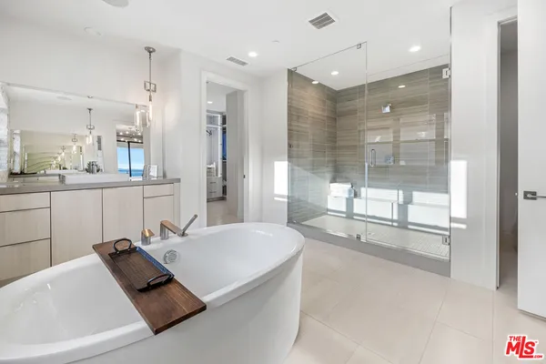a room with cabinets and washer dryer