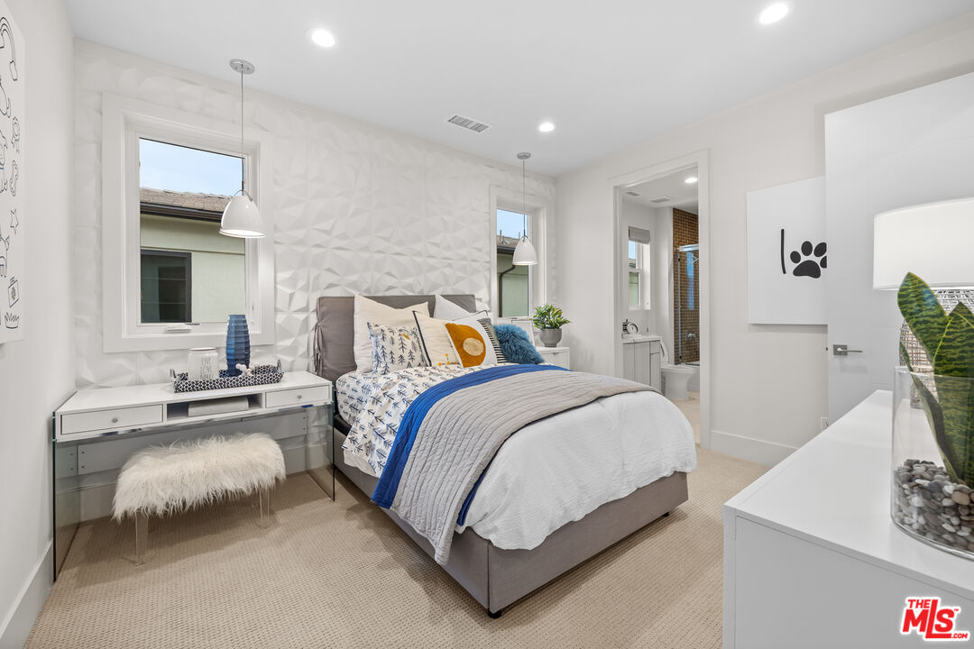 20378 Marlow Lane Porter Ranch, CA 91326 - Photo 32 of 52 a bedroom with bed and a potted plant