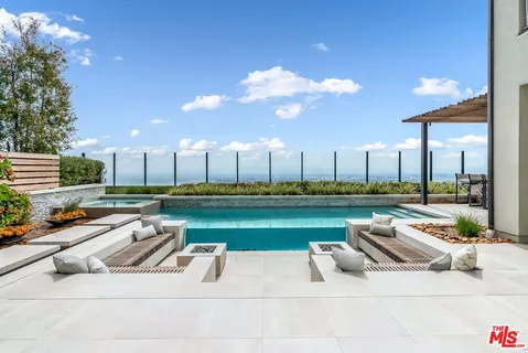a view of swimming pool from a balcony