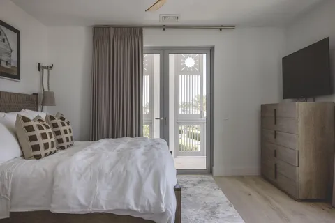 a bedroom with a bed and a television