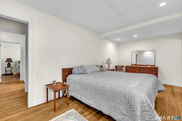 a bedroom with a bed and a table