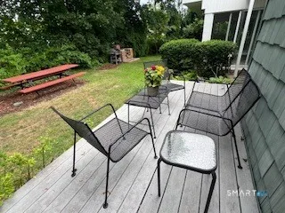 a view of a backyard with sitting area