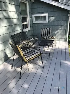 a view of a backyard with chairs