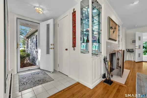 a view of a entryway with furniture and floor to ceiling window