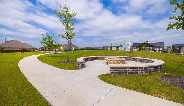 a view of a swimming pool with a yard