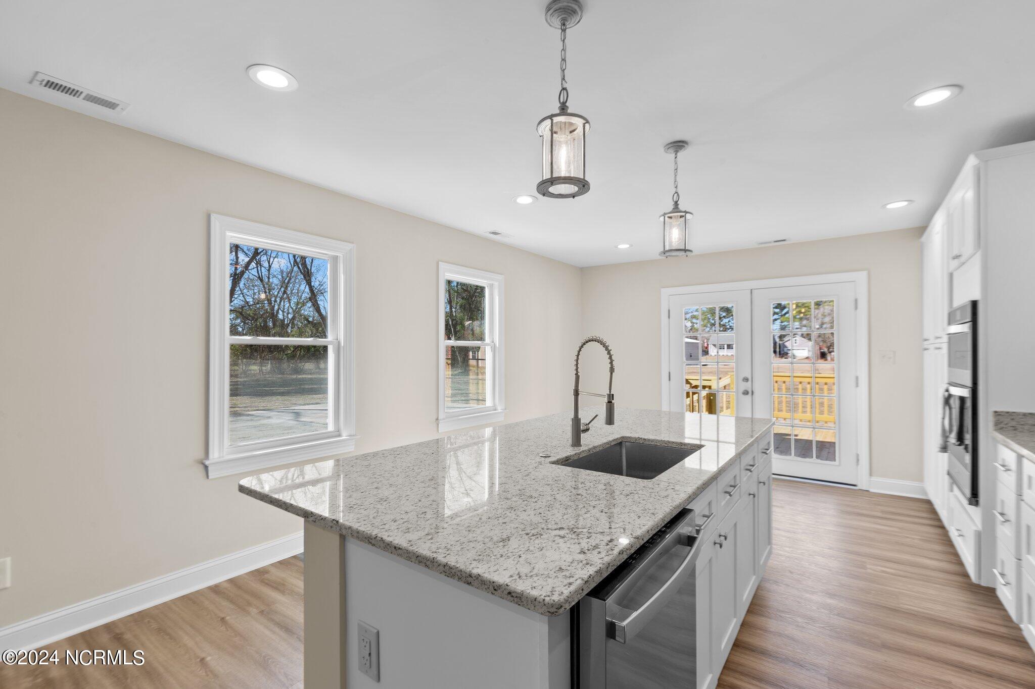 202 North 1st Avenue New Bern, NC 28560 - Photo 7 of 27 Kitchen showing exit to the deck