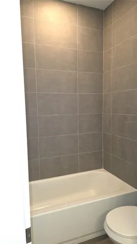 a bathroom with a bathtub and toilet