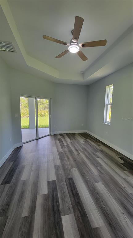 23498 Macbeth Court Punta Gorda, FL 33980 - Photo 23 of 27 a view of wooden floor and windows in a room