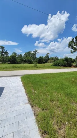 a view of an empty space with a lake view