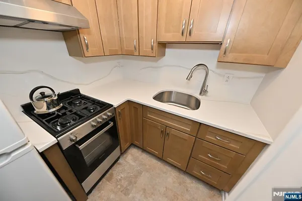 a bathroom with a sink and shower