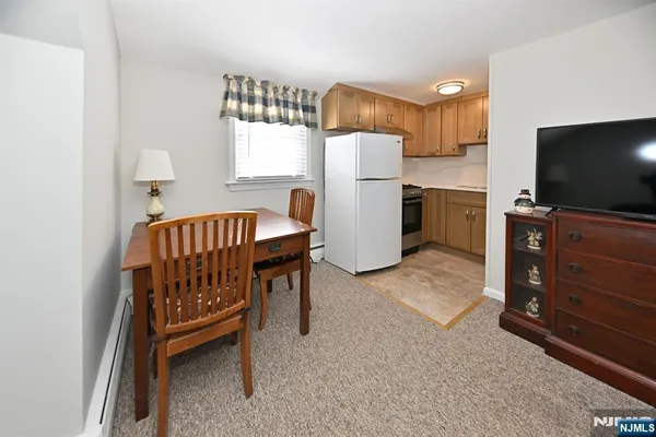 a kitchen with sink stove and cabinets
