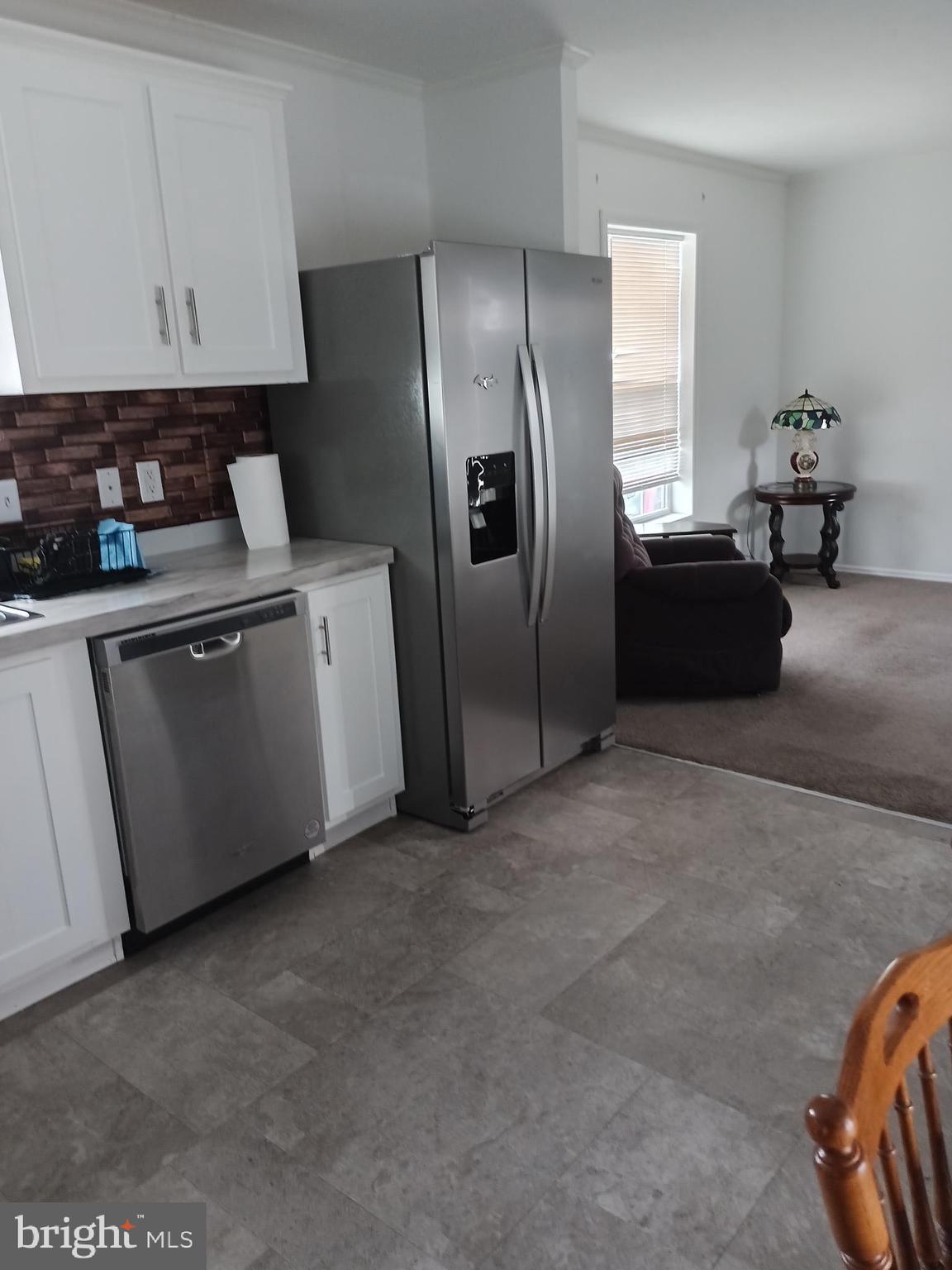 1405 Farrell Avenue, Unit 325 Cherry Hill, NJ 08002 - Photo 5 of 15 a kitchen with stainless steel appliances granite countertop a refrigerator and a stove