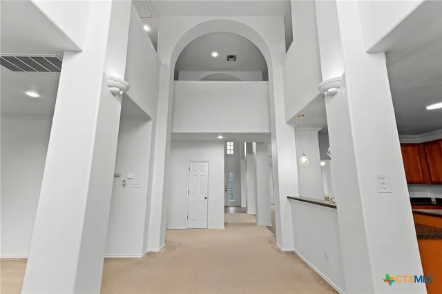 a front view of a house with a yard and a garage