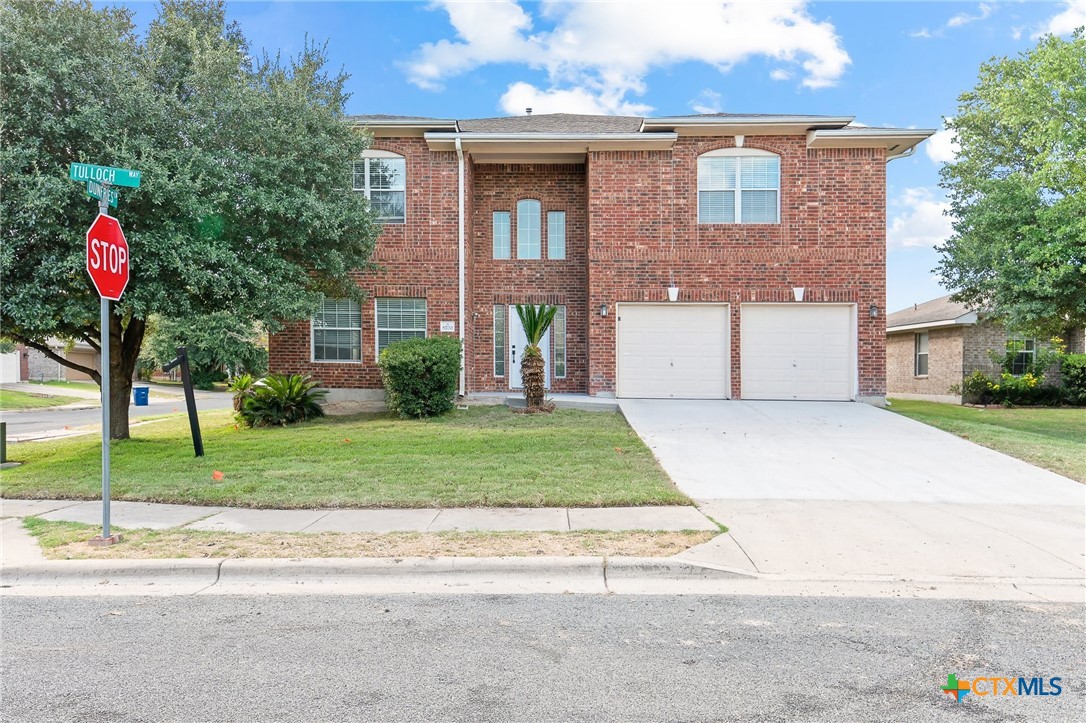 6700 Tulloch Way Austin, TX 78754 - Photo 2 of 41 a front view of a house with a yard and a garage