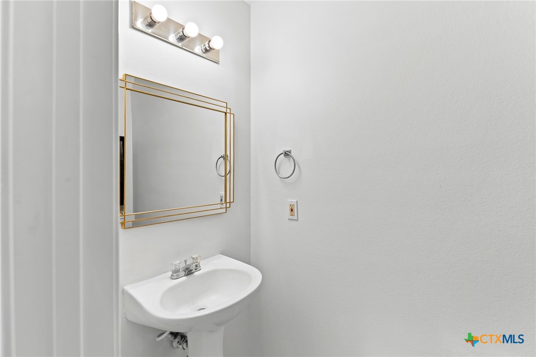 6700 Tulloch Way Austin, TX 78754 - Photo 22 of 41 a bathroom with a sink and a mirror