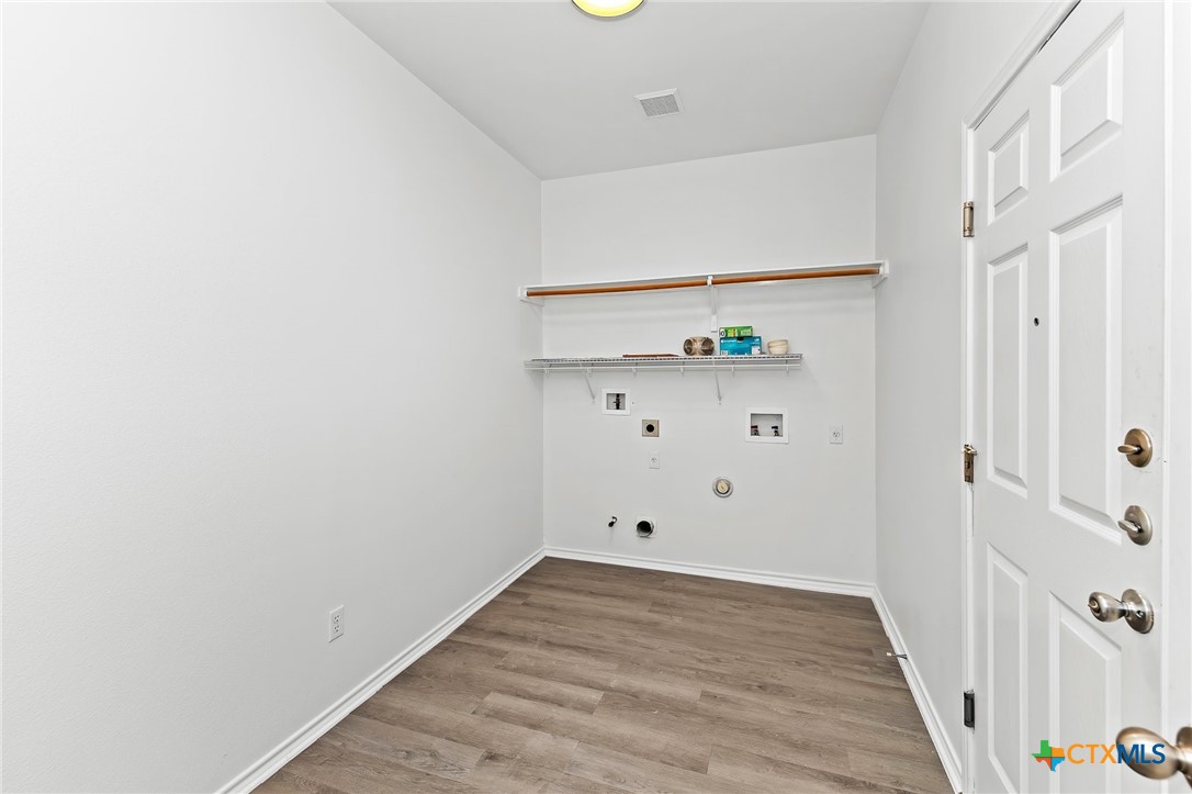 6700 Tulloch Way Austin, TX 78754 - Photo 23 of 41 a view of empty room with wooden floor