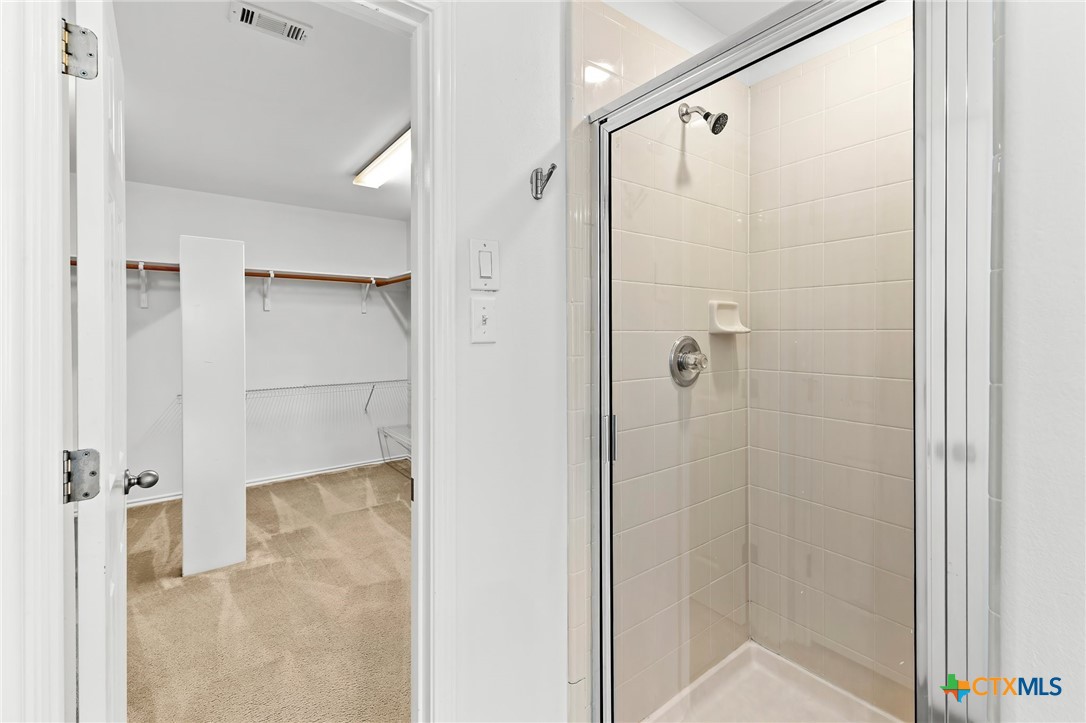 6700 Tulloch Way Austin, TX 78754 - Photo 30 of 41 a bathroom with a shower and a glass door