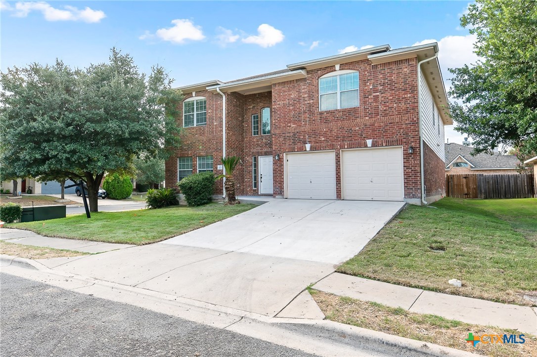 6700 Tulloch Way Austin, TX 78754 - Photo 3 of 41 a front view of a house with a yard and garage