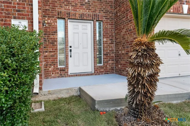 a bathroom with a bathtub and a view of bedroom