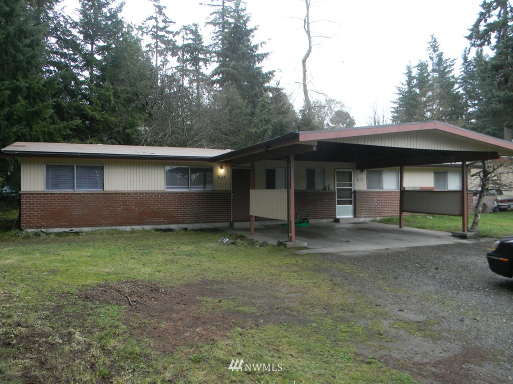 513 Roe Street Steilacoom, WA 98388 - Photo 2 of 14 a backyard of a house with barbeque oven