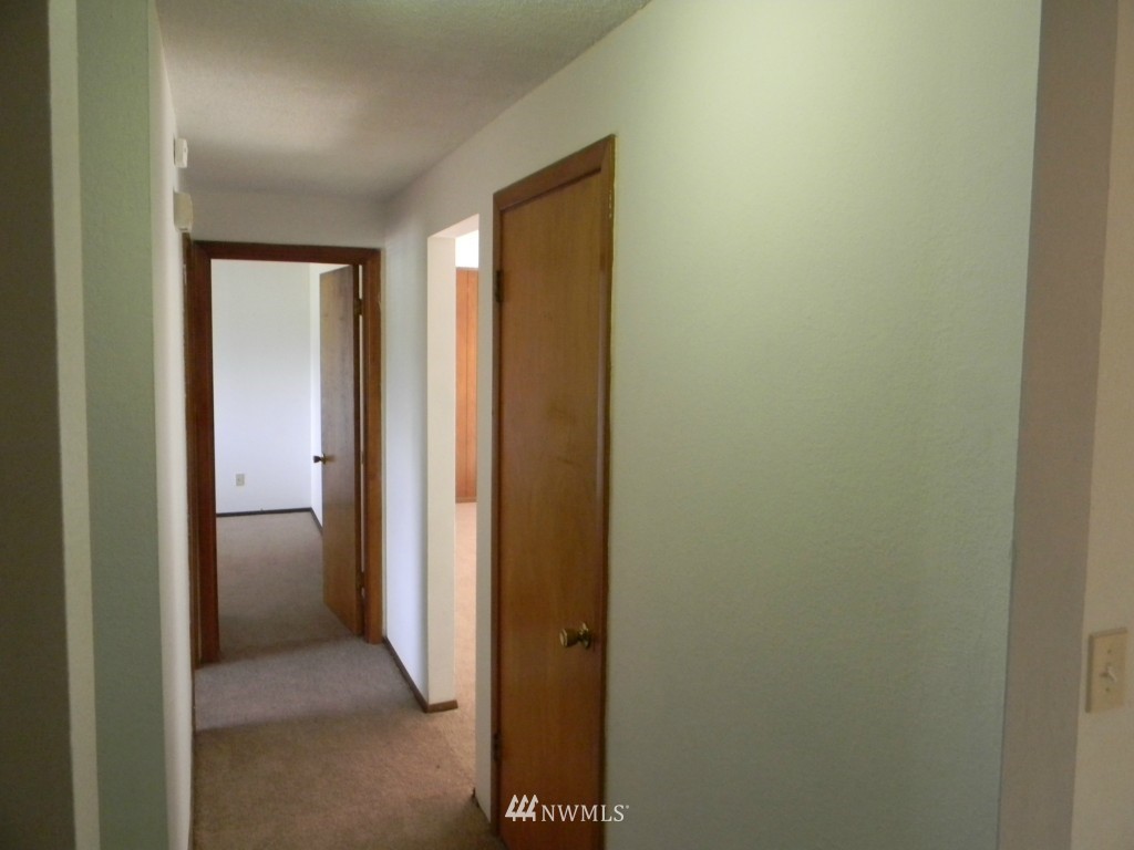 513 Roe Street Steilacoom, WA 98388 - Photo 11 of 14 a view of a hallway with a room