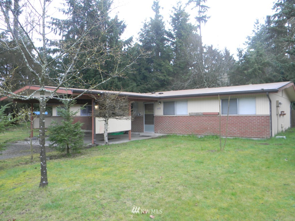 513 Roe Street Steilacoom, WA 98388 - Photo 3 of 14 a view of a house with a backyard