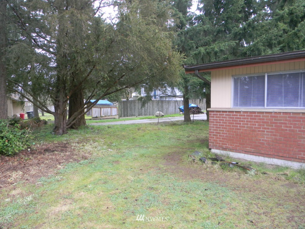 513 Roe Street Steilacoom, WA 98388 - Photo 5 of 14 a view of a house with a yard