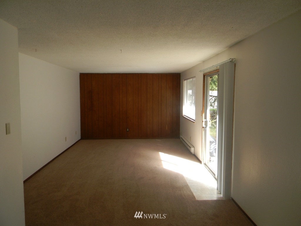 513 Roe Street Steilacoom, WA 98388 - Photo 6 of 14 an empty room with windows