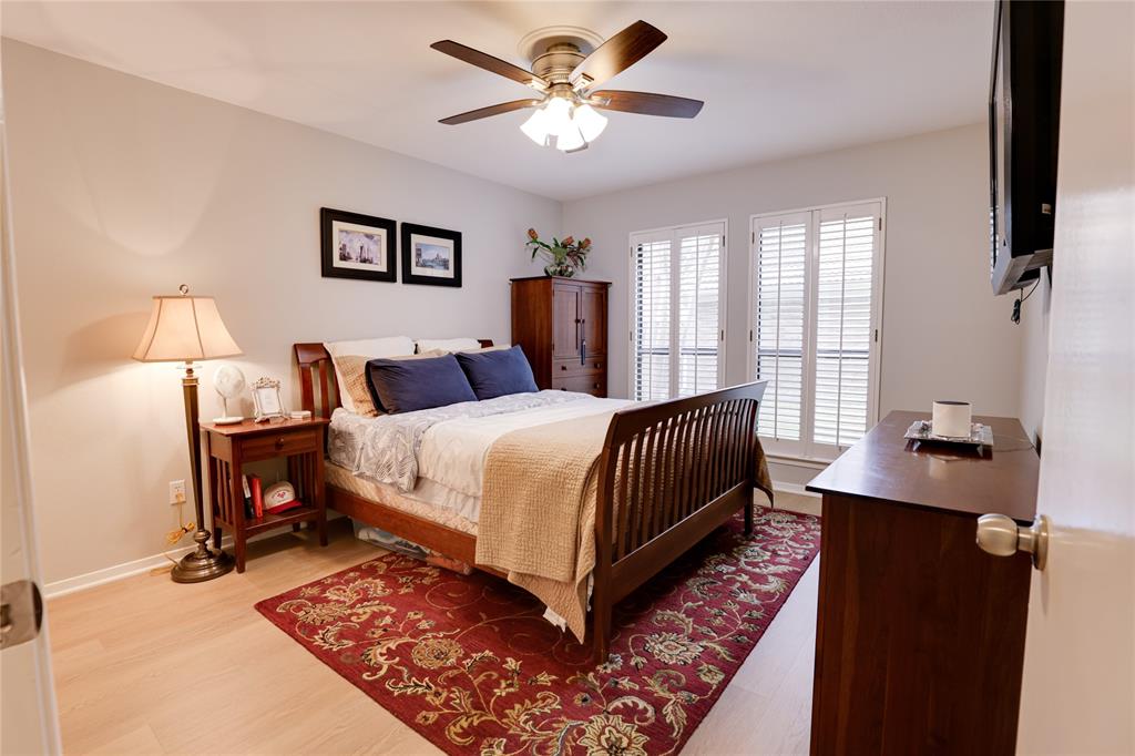 54 Legend Road Benbrook, TX 76132 - Photo 15 of 23 a bedroom with a bed and a chandelier
