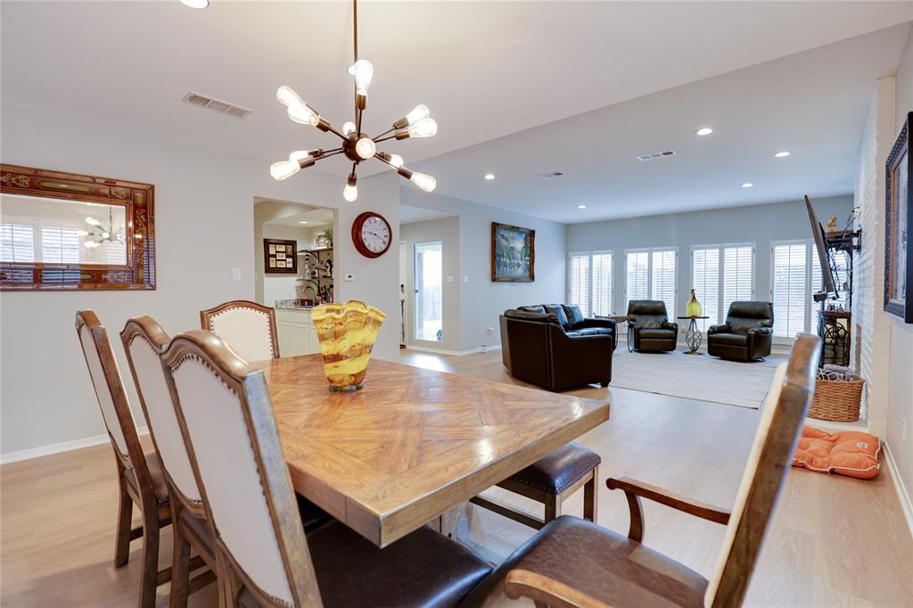 54 Legend Road Benbrook, TX 76132 - Photo 6 of 23 a view of a dining room with furniture and a chandelier