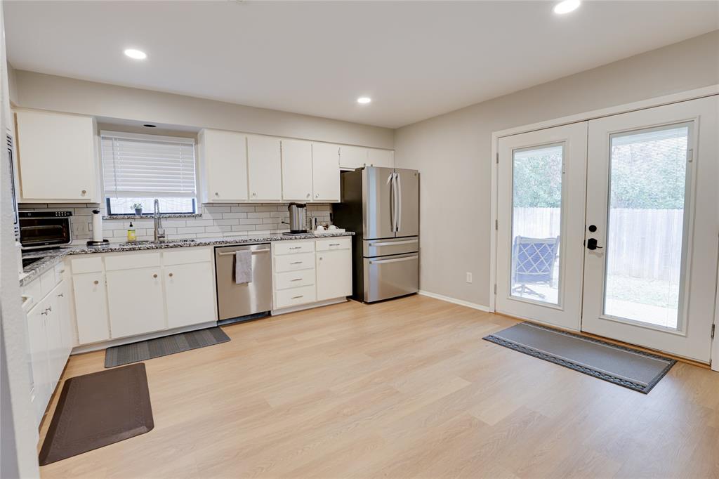 54 Legend Road Benbrook, TX 76132 - Photo 9 of 23 a kitchen with stainless steel appliances granite countertop a refrigerator sink and cabinets