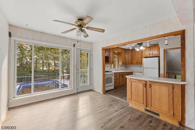 a view of a kitchen with a sink and microwave