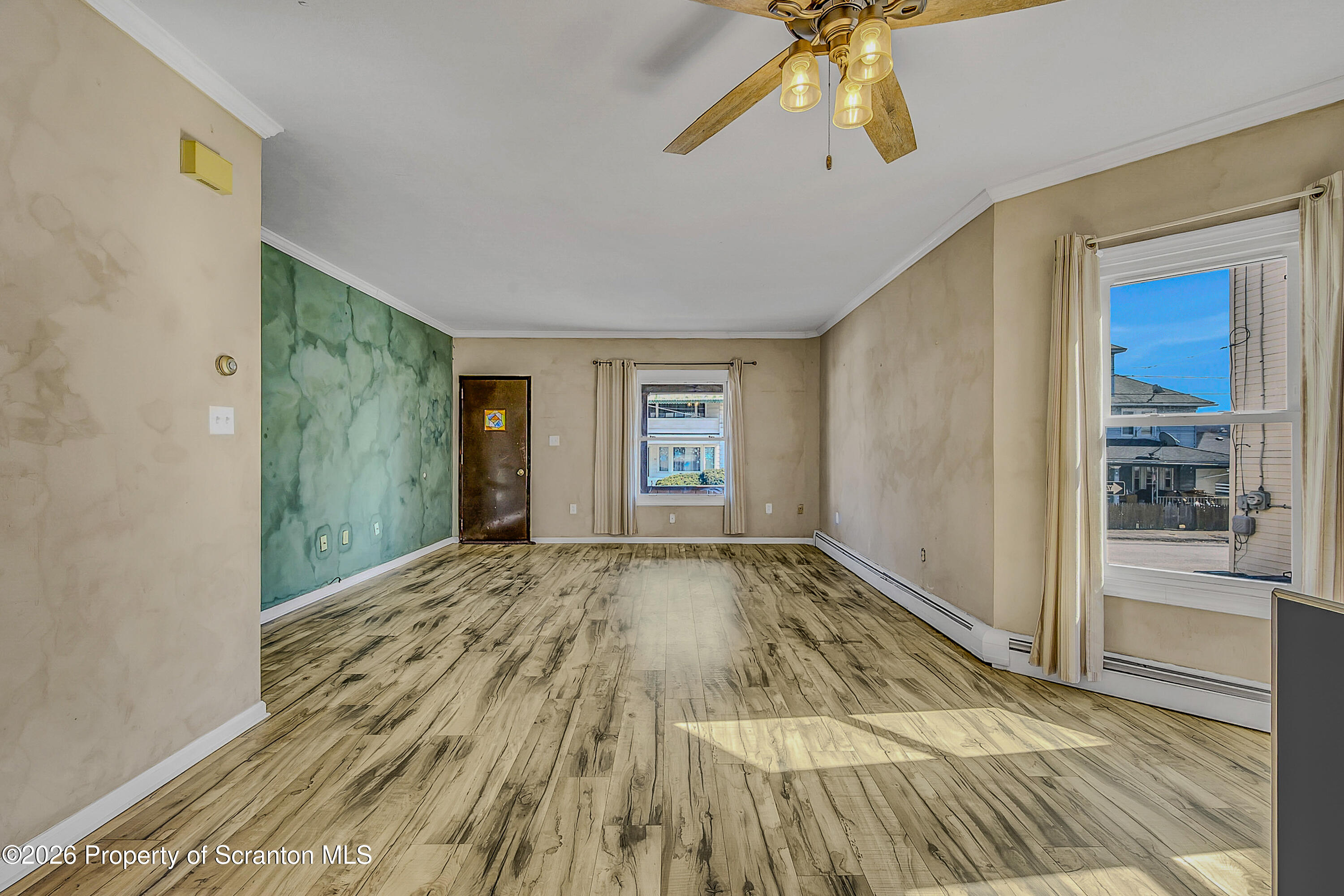 929 Ridge Avenue Scranton, PA 18510 - Photo 14 of 33 a view of an empty room with window and wooden floor