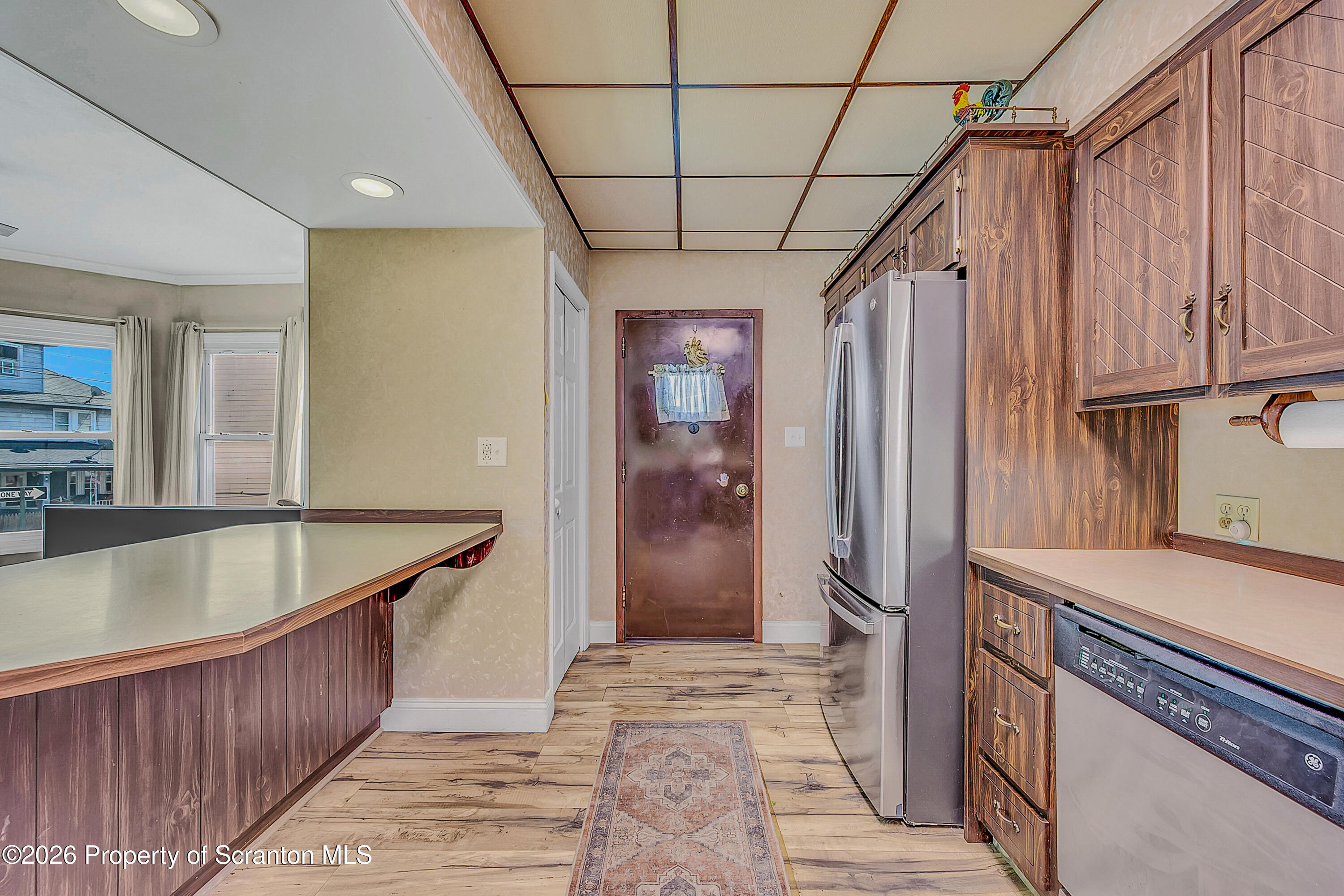 929 Ridge Avenue Scranton, PA 18510 - Photo 15 of 33 a kitchen with stainless steel appliances granite countertop a sink refrigerator and cabinets